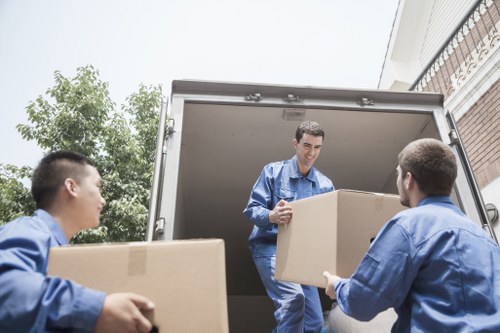 A moving team handling furniture during removal services in Kingston upon Thames