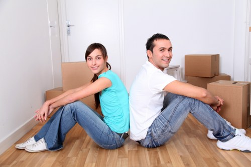 Boxes and furniture prepared for urgent removals in a Kingston home