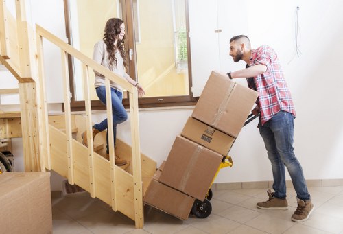 Packed boxes and furniture ready for a local apartment removal service