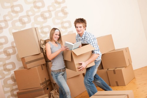 Professional movers handling fragile items carefully